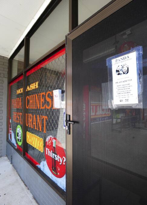 The scene of a robbery last night at the Panda Chinese Restaurant at the Monash Shops. Photo: Graham Tidy