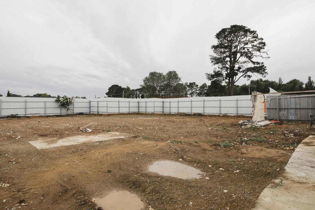 The site of the fire was bulldozed just before Christmas, and a corrugated iron fence was erected. Photo: Jamila Toderas