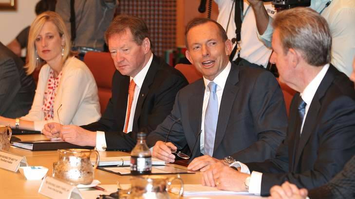 ACT Chief Minister Katy Gallagher, Dr Ian Watt, Secretary of Prime Minister and Cabinet, Prime Minister Tony Abbott and NSW Premier Barry O'Farrell, during the COAG meeting. Photo: Alex Ellinghausen