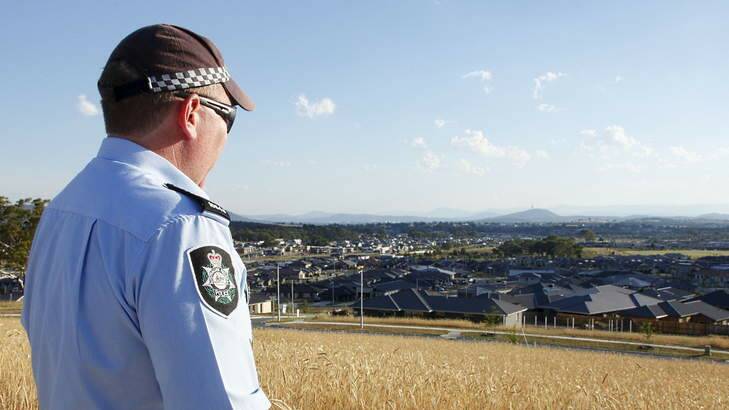 Sergeant Andrew Mitchell looks out over the sprawling expanse of residential construction in Gungahlin. Photo: ACT Policing