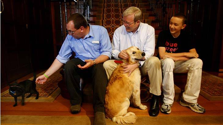 Happier times in The Lodge...Kevin Rudd with Abby and Jasper. Photo: Glen McCurtayne