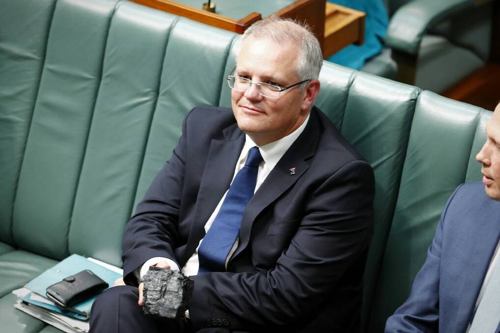 Then treasurer Scott Morrison with a lump of coal during Question Time at Parliament House in Canberra, on Thursday 9 February 2017. Photo: Alex Ellinghausen