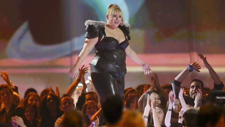 Rebel Wilson takes the stage to accept the award for breakthrough performance. Photo: Reuters