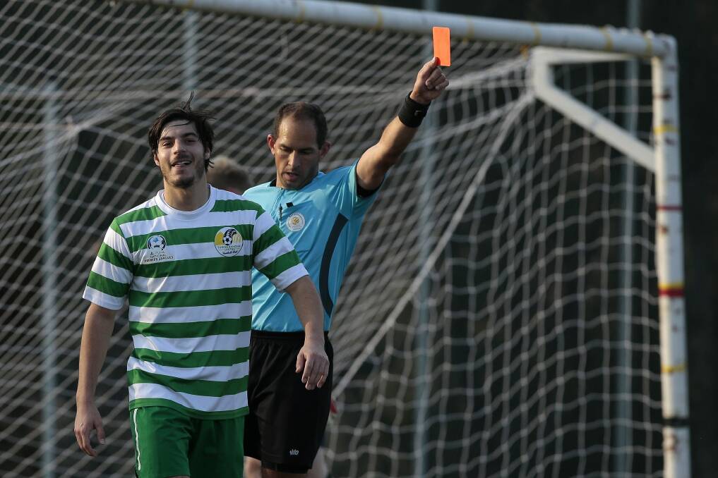 Tuggeranong United player Dominic Szrakity is shown a red card in Sunday's 2-1 loss to the Monaro Panthers. Photo: Jeffrey Chan