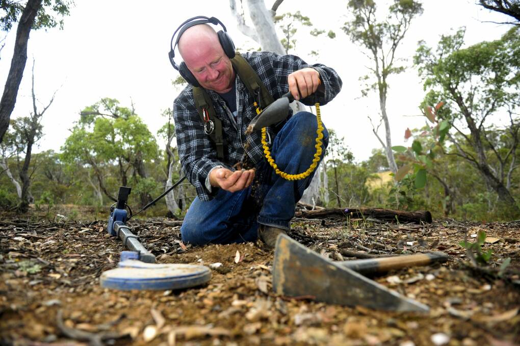 Gold goodies: Jamie Bell detecting for gold near Cooma.  Photo: Melissa Adams.