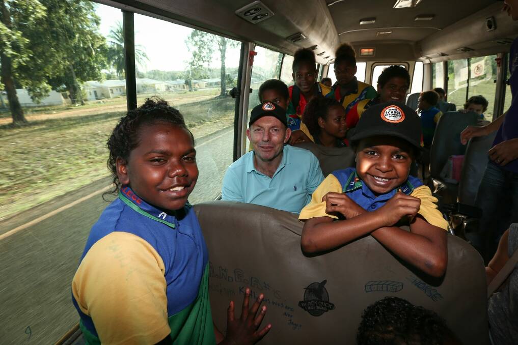 Prime Minister Tony Abbott joins the Remote School Attendance Strategy bus to pick up school children for school in Bamaga, during his visit to Cape York on Wednesday. Photo: Alex Ellinghausen