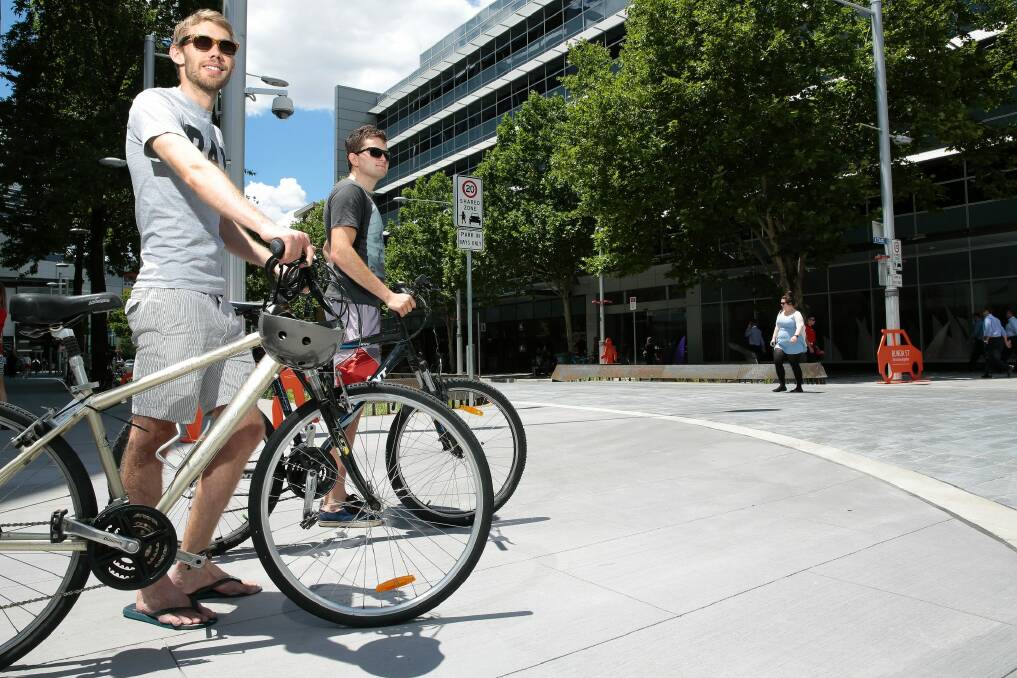 Clinton Madden and Sam Barton use one of the raised intersections on Bunda Street in Civic.   Photo: Jeffrey Chan