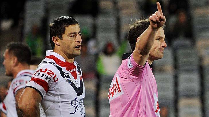 You're off! ... Roosters veteran Anthony Minichiello is given his marching orders by referee Alan Shortall after a high shot on Raiders fullback Josh Dugan at Canberra Stadium last night. Photo: Colleen Petch  
