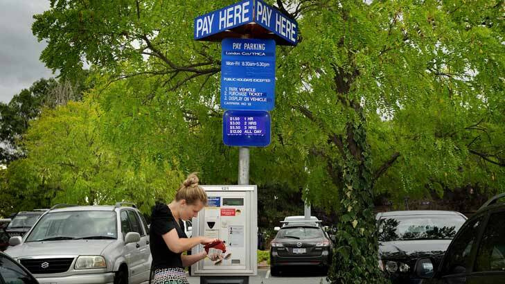 Parking fees in Canberra are on the rise ... Skye Stranger digs deep into her ourse to find the right change. Photo: Colleen Petch
