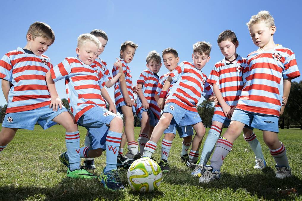 Woden Valley FC U8 team the Rooneys, from left, Reece Harrigan 7, Lucas Carey 7, Hendrix Stanier 8, Ziggy Kewetin- Smith 7, Michael Smith 7, Marc Papandrea 6, Isaac Palywoda 7, Max Mcardle 7 and Jack Davidson 7.  Soccer has had an increase of more than 1000 kids this season with Woden Valley FC having the biggest increase.   Photo: Jeffrey Chan