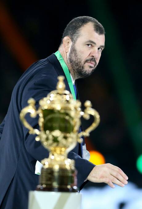 So close, so far: Michael Cheika passes by the Webb Ellis Cup following defeat in the 2015 Rugby World Cup final. Photo: David Rogers