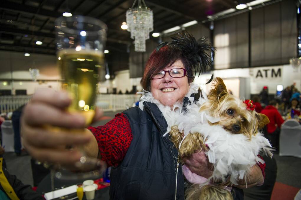 Rhonda Kennedy with Houri, a Yorkshire terrier at the high tea.  Photo: Rohan Thomson