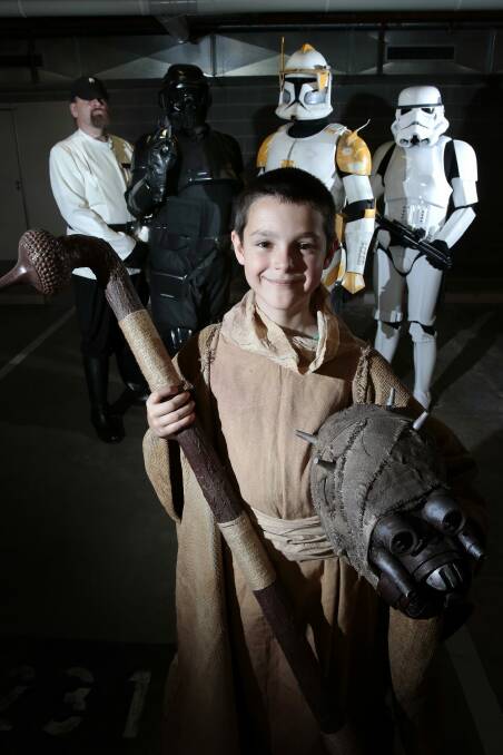 Unmasked:  Star Wars fans,  Zachary Kirk 9, of Tuggeranong, front with, rear from left, Drew Ridley of Macgregor, Toby Shorter of Woden, Travis Kirk of Tuggeranong and Karl Tyler of Bonner. Photo: Jeffrey Chan