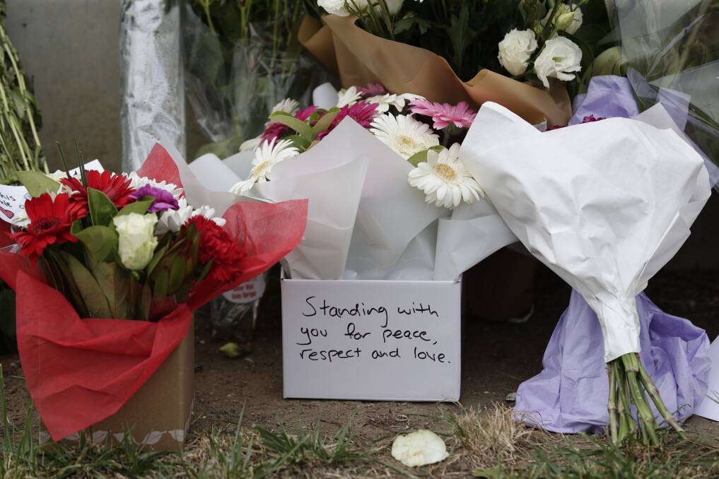 Flowers left at the front gate of the New Zealand High Commission in Canberra Photo: Alex Ellinghausen