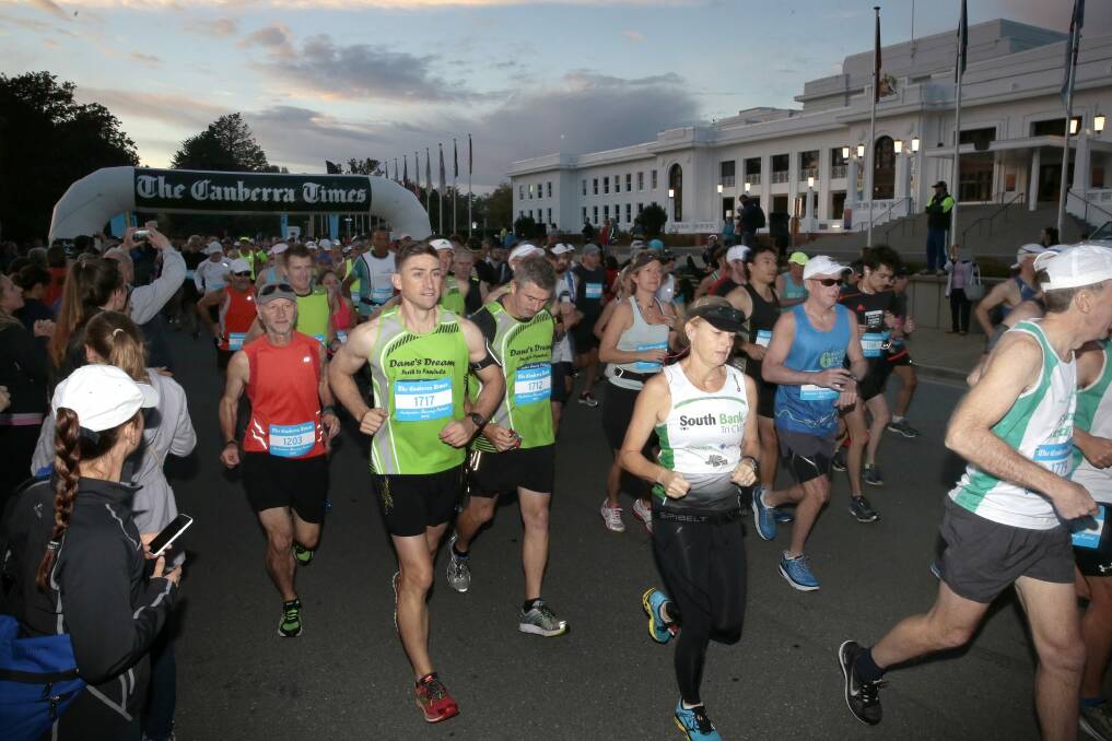 Runners set of the start line at the beginning of the Canberra Times Marathon in front of Old Parliament House.   Photo: Jeffrey Chan