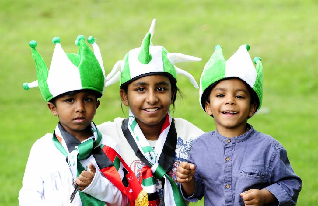 The Almesamah family, Fahad, 7, Reoof, 11, and Saud, 6, all of Harrison, at Canberra Stadium to see the United Arab Emirates take on Qatar. Photo: Melissa Adams