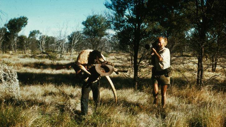  Ian Dunlop filming Shorty Bruno (carrying kangaroo) near Yayayi in the Northern Territory in 1974.   Photo: Ian Dunlop
