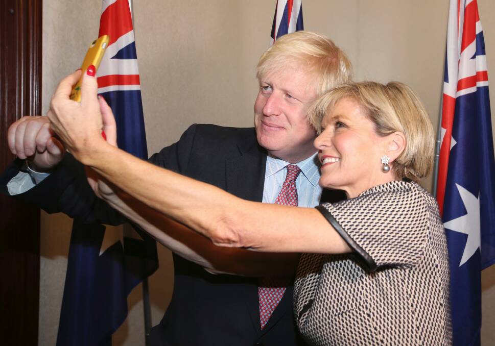 British Foreign Secretary Boris Johnson has a selfie with Australian Foreign Minister Julie Bishop ahead of their bilateral meeting in Sydney. Photo: AP
