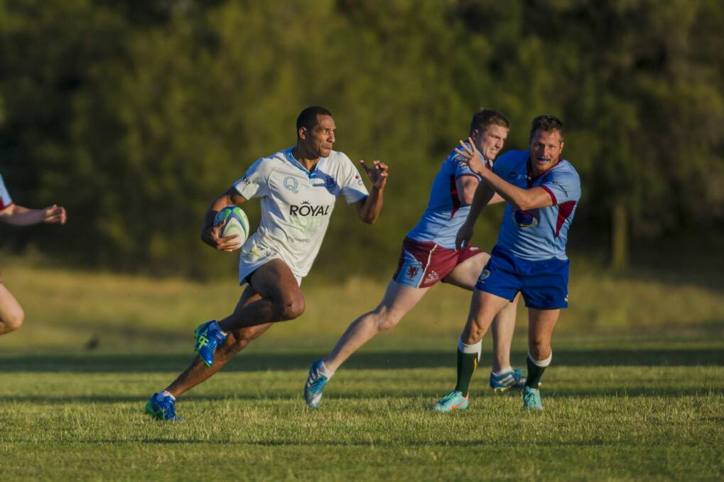 Queanbeyan's Ratu Tagive makes a break against Wests in the ACT Rugby Union club sevens competition last Friday. Photo: Jamila Toderas