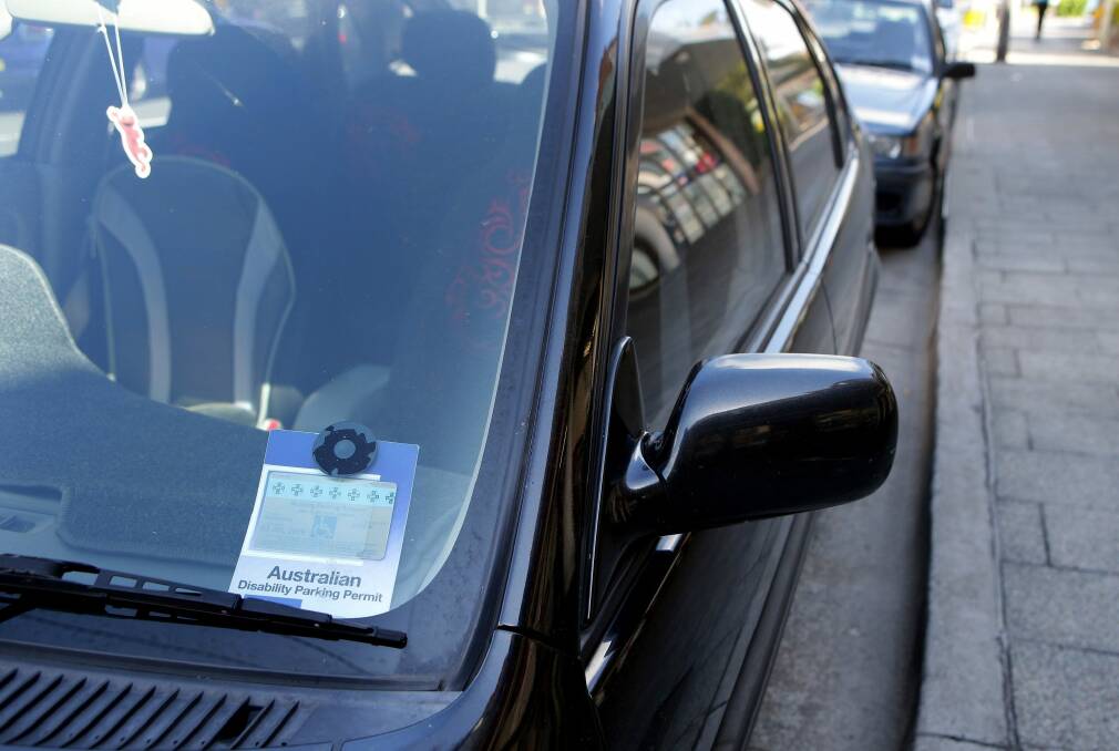 A Canberra woman was fined for failing to display her ACT mobility parking permit inside the Australian Disability Parking Permit plastic sleeve as pictured. Photo: John Veage