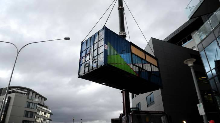 The pop-up bar being lowered at the Aurora Residences in Kingston Foreshore. Photo: Melissa Adams