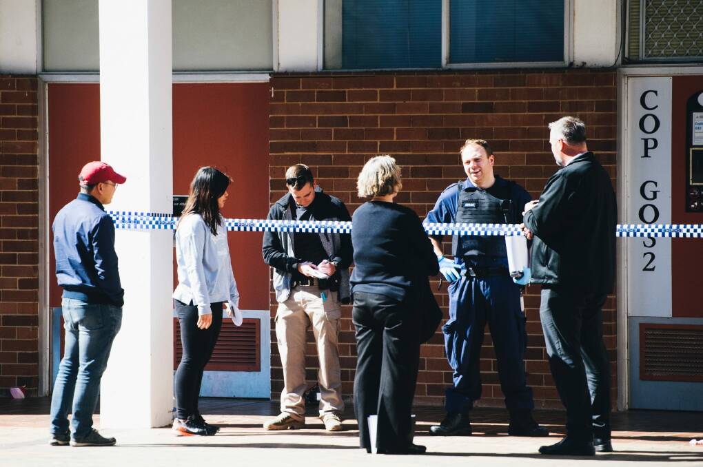 Scenes at the ANU after a man was arrested after allegedly attacking several people with a baseball bat in the Copland building. Photo: Rohan Thomson