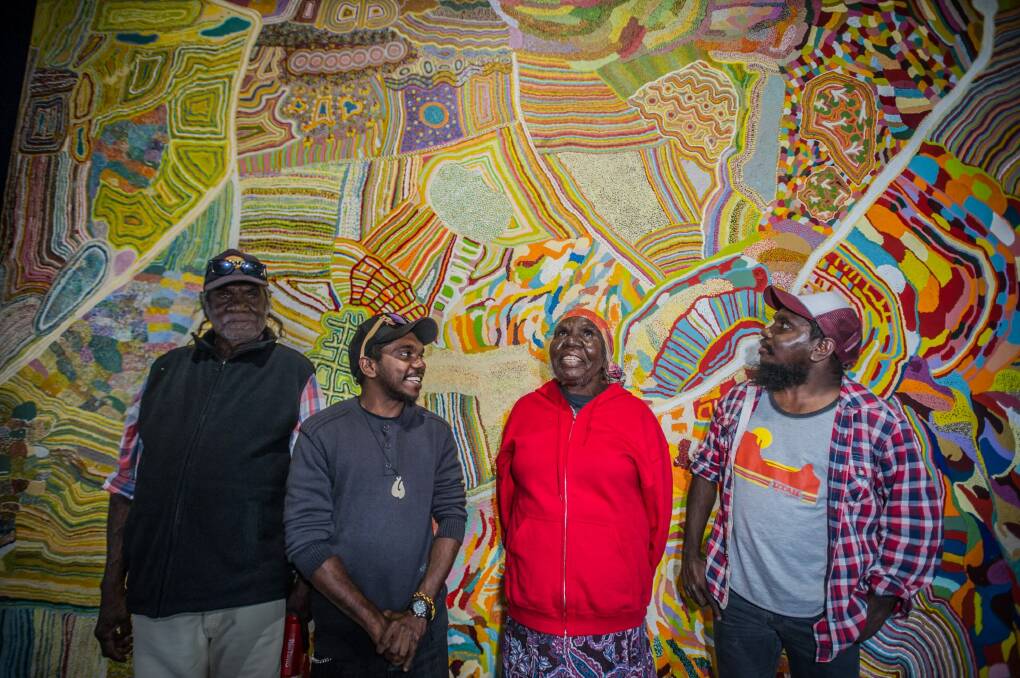 Muuki, Ignatius, Nola and Curtis Taylor stand in front of the painting Yarrakalpa.  Photo: Karleen Minney 