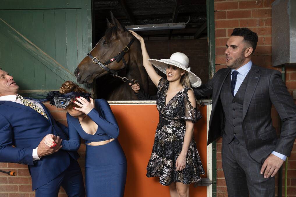 Never work with kids or animals: Fashions on the Field judges Lee Campbell, Kristen Henry, Bethany Larsen and Nick Risteski in an unfortunate outtake from The Canberra Times shoot. Photo: Lawrence Atkin