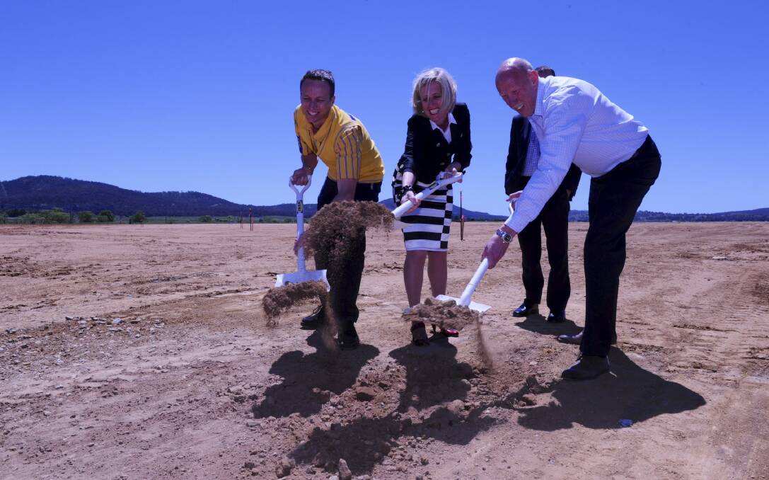 Breaking ground: Canberra store manager Mark Mitchinson, left, Chief Minister Katy Gallagher and Ikea Australia country manager David Hood turn the first sods on the Canberra store site. Photo: Graham Tidy