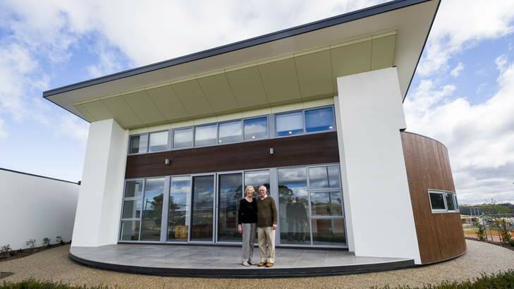 Anna and Phillip Burroughs outside their new home. Photo: Rohan Thomson