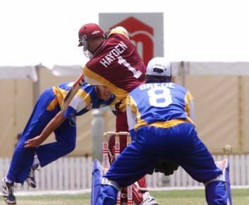 Matthew Hayden takes on the old Comets in 1999. Photo: Kylie Pickett
