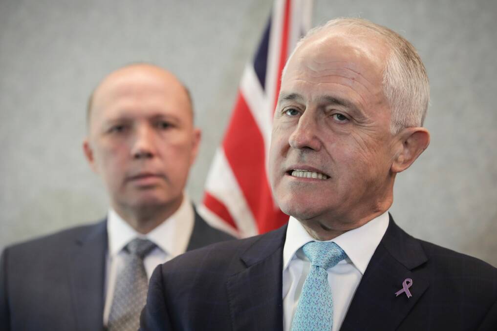 Minister for Home Affairs Peter Dutton and Prime Minister Malcolm Turnbull address the media at a doorstop interview during a visit to the Australian Federal Police (AFP) Forensics Facility in Canberra on Monday 26 March 2018. fedpol Photo: Alex Ellinghausen Photo: Alex Ellinghausen