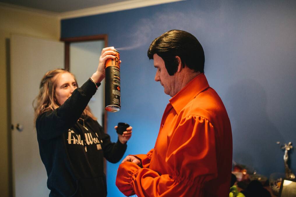Garry Buckley often calls in his daughter, Erica, to help him prepare for an Elvis show. Photo: Rohan Thomson