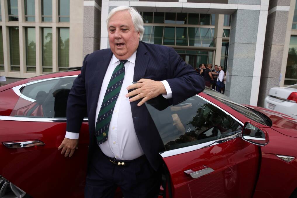 Clive Palmer arrived at Parliament House on Thursday in a Tesla electric car. Photo: Andrew Meares