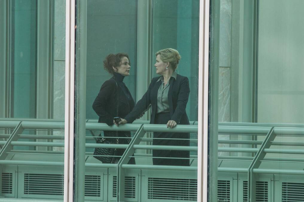 Sigrid Thorton as Lara Dixon, CEO of private cybersecurity film, and Robyn Malcolm as Minister for Foreign Affairs Marina Baxter at Parliament House in the second series of The Code. Photo: Kate Ryan