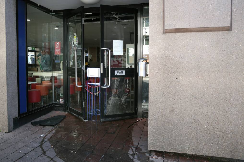 A shattered glass door at  McDonald's in Braddon. Photo: Jeffrey Chan