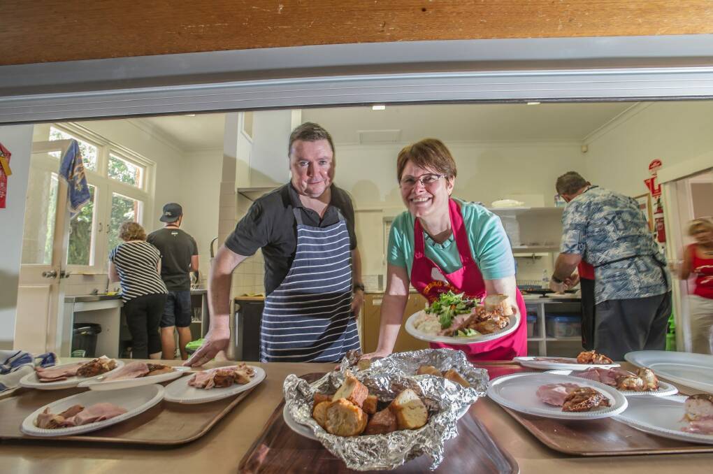 Bruce Millar and Annette Pilloni help to dish up two course Christmas lunch for 250.  Photo: Karleen Minney