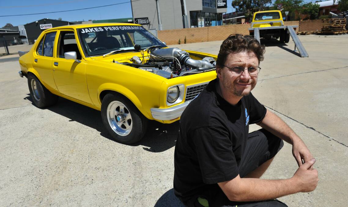 Performance mechanic Jake Edwards with his highly modified L J Torana in 2013. Photo: Graham Tidy