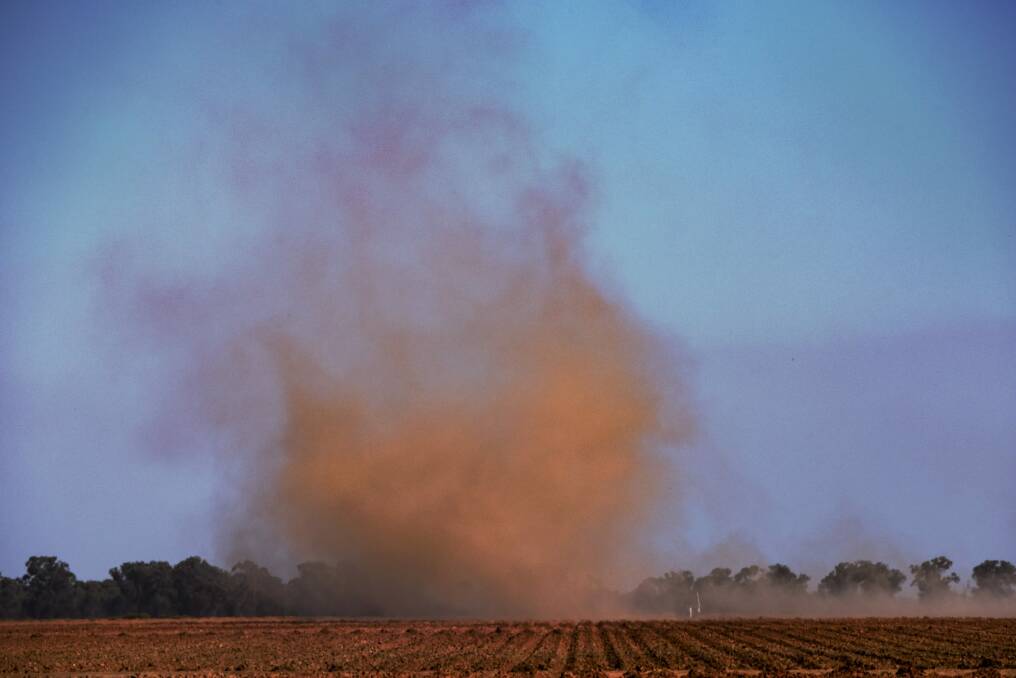 Wind whips up the dust over a dry farm in the Deniliquin region. Photo: Nick Moir