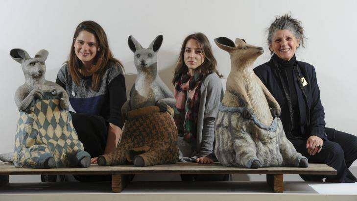 Australian Ceramics Triennale project managers Yasmin Masri (left) and Gwenyth Macnamara with chairwoman Avi Amesbury, pictured with Bev Hogg’s work <i>Wooly Jumpers 1, 2 and 3</i>, which feature in Craft ACT’s exhibition <i>Stomping Ground</i>, in the ACT Legislative Assembly gallery. Photo: Graham Tidy