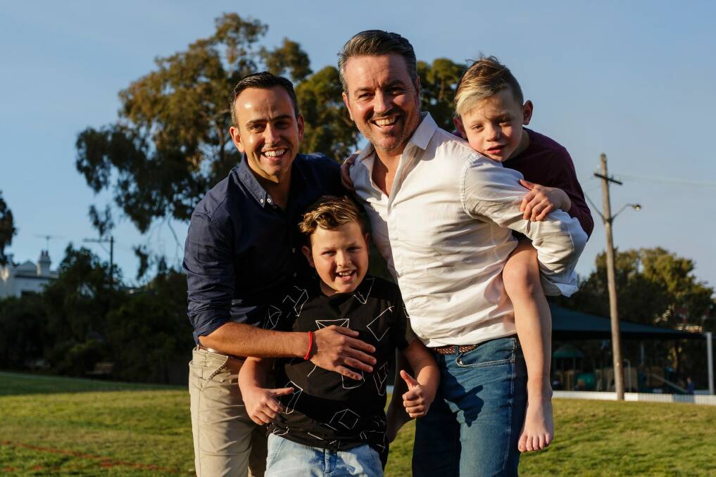 Simon Duffy and his partner Wally Murphy with their sons, Corey (12) and Val (6), in Rozelle. Photo: Brook Mitchell