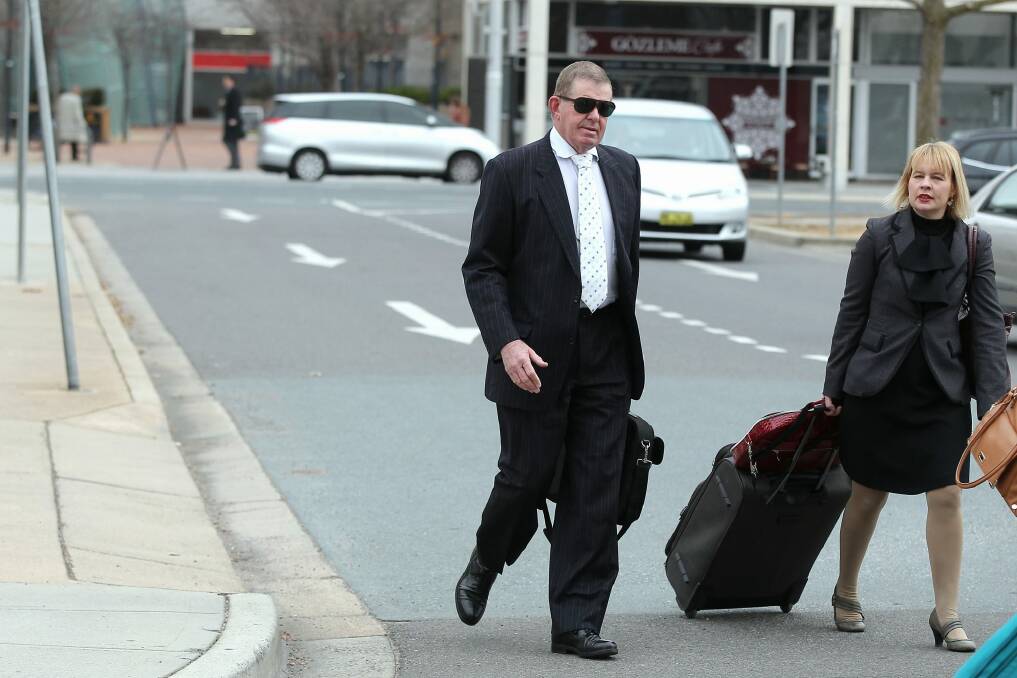 Former Federal Speaker Peter Slipper and his defence lawyer, Kylie Weston-Scheuber, arrive at the ACT Magistrates Court on day two of a hearing into Slipper's alleged misuse of his parliamentary travel entitlements.  Photo: Alex Ellinghausen