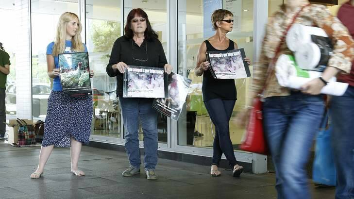 From left, Animal Liberation ACT members Jessica Hare, Carolyn Drew and Benice Richmond appeal to shoppers at the Canberra Centre. Photo: Jeffrey Chan