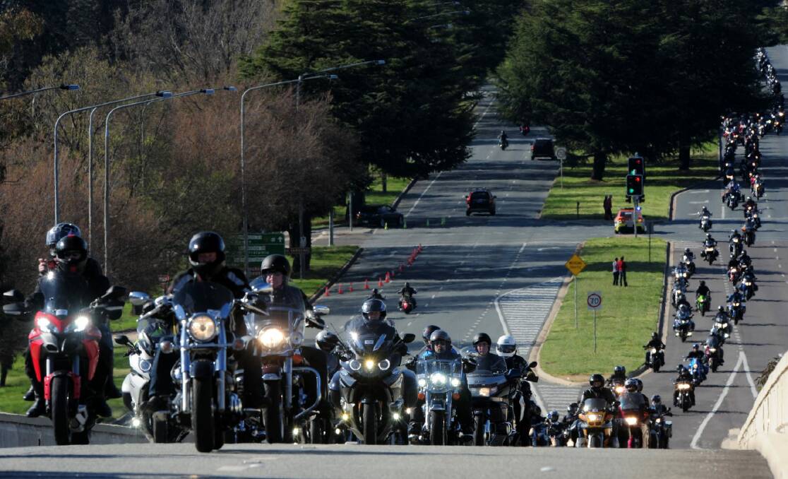 The Wall to Wall: Ride For Remembrance, makes its way toward Parliament House from the Commonwealth Avenue Bridge, bound for the Police Memorial site by Lake Burley Griffin.  Photo: Graham Tidy