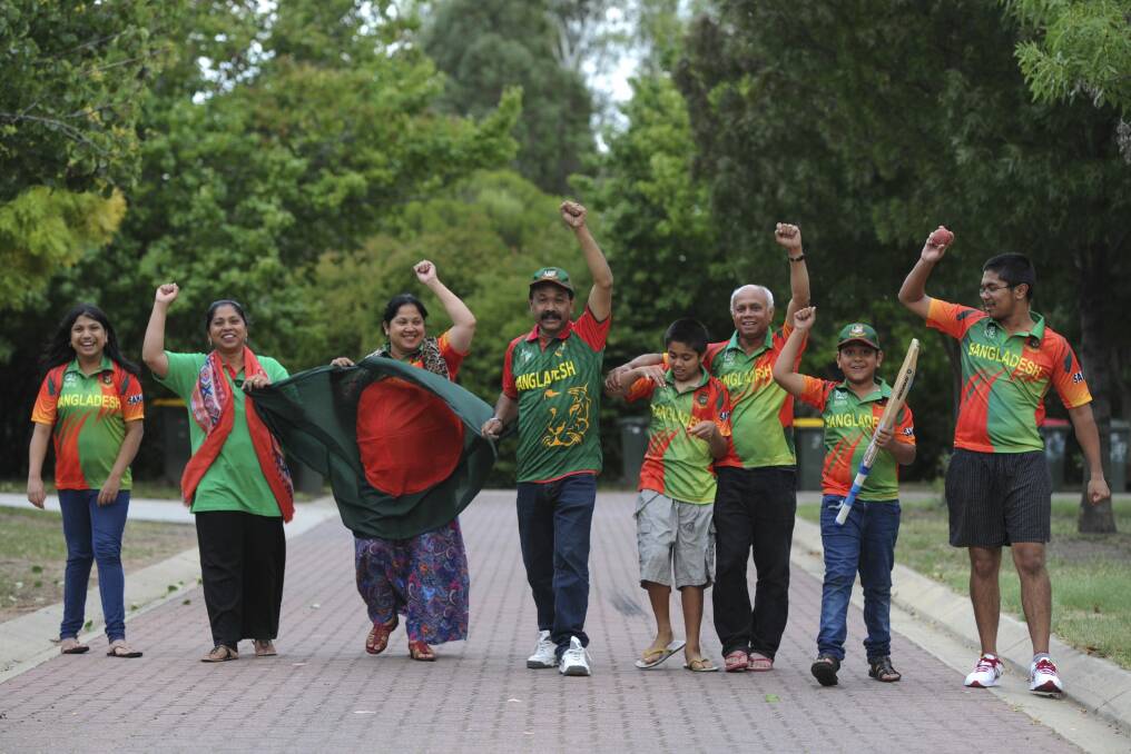 Members of Canberra's Bangladeshi community gear up for the World Cup match at Manuka Oval. From left, Fabia Afnan, Murshida Zaman, Asma Dewan, Nazrul Islam, Mufrad Zaman, Tarik Zaman, Arthee Nazrul and Mansib Zaman. Photo: Graham Tidy