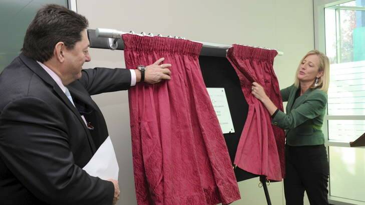 OPENING DAY: UXC managing director Cris Nicolli watches on as Chief Minister Katy Gallagher opens the company's new premises in Canberra. Photo: Graham Tidy