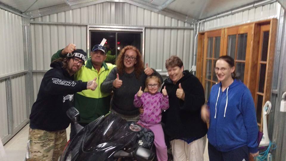 Heidi Pritchard celebrating with neighbours after her beloved Hayabusa motorcycle was returned to her. Photo: Facebook