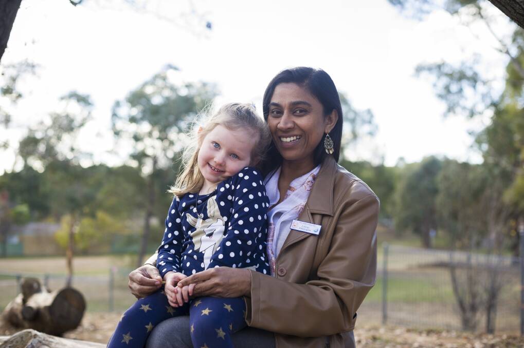 Miles Franklin preschool teacher, Lalangi Abhayapala, with her student Annabelle Potts. Photo: Dion Georgopoulos