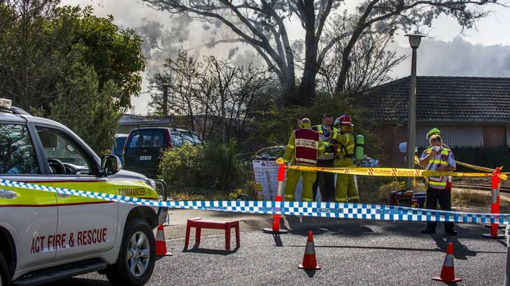 ACT Fire and Rescue work to bring a house fire under-control at Somerville St in Spence. Photo: Rohan Thomson