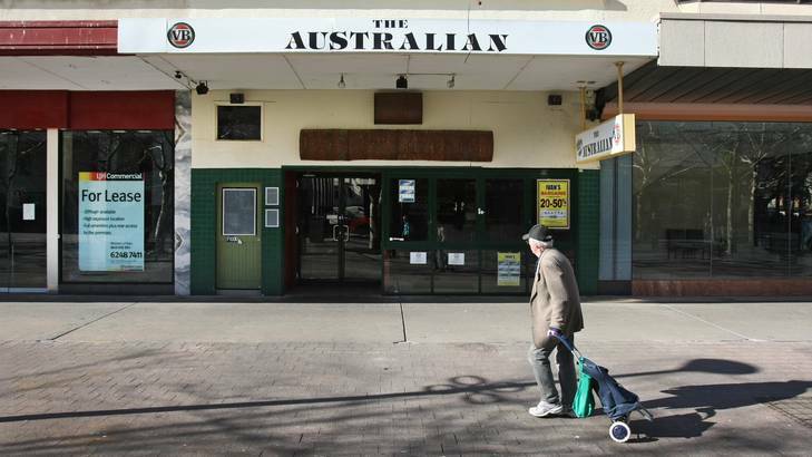 A man walks past closed businesses in Garema Place, Civic. Photo: Andrew Sheargold